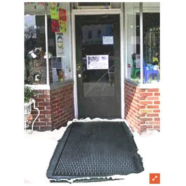 Ice Away Mat 1 Floormat.com The <strong>Ice-Away™</strong> <strong>snow & ice melting mat, </strong>formerly known as the Greener Heat™ Heated Door Mat combines a rugged, non-slip outdoor mat with a snow-melting system that keeps entrances safe from the harsh winter environments. The Ice-Away™ snow & ice melting mat provides safer footing during snowy winter months by melting snow and slush for pennies a day. Additionally, they provide radiant heat indoors, helping reduce heating costs while providing warmth and helping to dry the floor during winter months. <strong>Features & Benefits</strong> <ul> <li>Product Dimensions: 35" L x 33" W x 0.5" thick</li> <li>Keep up with snow as fast as it falls and forget about constant shoveling and salting sidewalks.</li> <li>Prevent dangerous & icy conditions. Avoid slip-and-fall injuries</li> <li>240 watts</li> <li>Weight: 17lbs, Power Density: 40 Watts per square foot, In-Line Safety Device/Power Cord Service Voltage 120 Vac ELCI trip level 27 mA</li> <li>G.F.C.I. attached to the 15 foot cord.</li> <li>produces a 40 to 50 degree Fahrenheit rise in surface temperature over the ambient temperature, melting snow and ice 24/7</li> <li>Economical, using only 35 watts per square foot.</li> <li>The molded rubber mat features heavy-duty construction that is made to last for years.</li> <li>Will help prevent thick ice build up when properly used. Designed to stay on all winter, the mat may also be used without power in warmer periods, making a very nice entrance mat all year round.</li> <li>These heated entrance mats are an ideal size for residential use – use outdoors to melt snow and ice, or indoors as a heat source in non heated areas.</li> </ul> <b>Outdoor Uses</b> <ul> <li>Entry Ways</li> <li>Porch</li> <li>Around Hot Tub</li> <li>Decks</li> <li>Ramps</li> <li>Loading docks</li> <li>Hospitals</li> <li>Nursing Homes</li> <li>'Handicap-accessible structures</li> <li>Hotels</li> <li>Schools</li> <li>Churches</li> <li>Private homes</li> </ul> <b>Electrical & Approvals:</b> <ul> <li>115VAC, 120W</li> <li>ETL Listed</li> <li>Conforms to UL Std 499</li> <li>Certified to CAN/CSA Std C22.2 No. 46</li> </ul> <h3 class="spotlight">Photo shows the Heated Door Mat in 10°F. weather, and 6" of fresh snowfall</h3> <form action="https://www.aitsafe.com/cf/addmulti.cfm" method="post"></form>