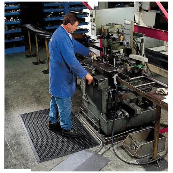 SaniTop 3 Floormat.com Sanitop® is made from a durable rubber compound designed to withstand harsh chemicals while creating a slip resistant surface. An alternating large and small hole drainage system channels liquid and debris away from the work area further enhancing the traction of the mat. Molded in beveled edges on all four sides eliminates trip hazards. Sanitop® offers a simple, economical solution for wet environments in many industrial or food service applications. <ul> <li>Durable rubber compound</li> <li>Molded alternating large/small hole drainage system keeps moisture and debris away from work area</li> <li>Raised pattern surrounds large holes to channel drainage and provide worker traction</li> <li>Molded beveled ramps on all 4 sides to minimize trip hazards</li> <li>Available in 2 versions:</li> <li>Black grease resistant mat - carries a 1-year warranty</li> <li>Red grease-proof mat with extra nitrile content - carries a 3-year warranty</li> </ul>