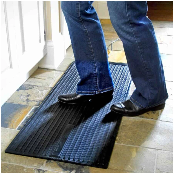 super foot warmer Floormat.com Safe and economical – using one tenth the energy of dangerous space heaters. <ul> <li>The Super Foot Warmer is waterproof and designed to be used indoor and outdoor</li> <li>Uses only 135 watts; 90% less than a standard 1,500 watt space heater</li> <li>TUV Certified to UL 499:2005 R3.06 (U. S. only, not Canada): meeting strict safety standards</li> <li>Warms cold feet directly through shoes or boots</li> <li>Perfect for under desks & standing work stations</li> <li>May be used to melt snow from boots, leaving them warm & dry</li> <li>Can be used in on hard surfaces where water is often sprayed on the floor</li> <li>Super Foot Warmer Floor Mat generates a radiant heat which creates an extremely comfortable even heat which can reduce fatigue, increase productivity and stimulate circulation while sitting or standing</li> <li>Increased economy and safety!</li> <li>Even should the Super Foot Warmer Floor Mat be left on, it assures safety and lower energy costs than space heaters.</li> <li>Ideal for people who spend long hours on their feet or in cold environments, including bank tellers, toll booth operators, warehouse workers, machinists and any other users of space heaters</li> <li>Designed for use on hard floors only (do not use on carpet)</li> <li>Dimensions: 36.25″ L X 16″ W X .25″ Thick</li> <li>Weight: 11 lbs</li> <li>1.2 amps</li> </ul> There is a two year warranty/replacement policy. The U.S. Consumer Product Safety Commission estimates that more than 25,000 residential fires every year are associated with the use of room (space) heaters. More than 300 persons die in these fires. An estimated 6,000 persons receive hospital emergency room care for burn injuries associated with contacting hot surfaces of room heaters, mostly in non-fire situations. What You Can Expect From The Super Foot Warmer Floor Mat When the room temperature is 68 degrees the floor temperature is generally about 60 degrees except on an outside wall. The floor temperature on an outside wall could be as low as 53 degrees and could be colder on a slab floor . This is why one experiences cold feet and legs. The surface temperature will vary depending upon the floor temperature. <ul> <li>If the floor temperature is 64 degrees, the surface temperature of the Super Foot Warmer Floor Mat will be 110-112 degrees.</li> <li>If the floor temperature is 53 degrees, the surface of the Super Foot Warmer Floor Mat will be 105-108 degrees.</li> </ul> <a href="https://www.floormat.com/foot-warmer-mats-faqs/">Foot Warmer Mats FAQs</a>