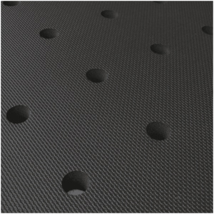 A close up of a black mat with holes in it.