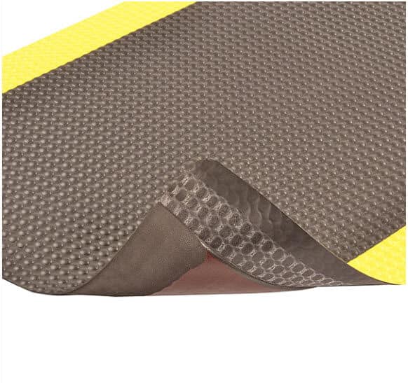 A black and yellow mat with a yellow stripe.