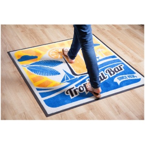 A person walking on a ColorStar Impressions Logo Floor Mat.