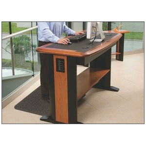 A man utilizing the Get Fit Stand Up Anti-Fatigue Floor Mat while working at a standing desk to get fit.