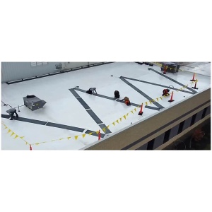 An aerial view of people working on a Commercial Heated Roof Mat System.