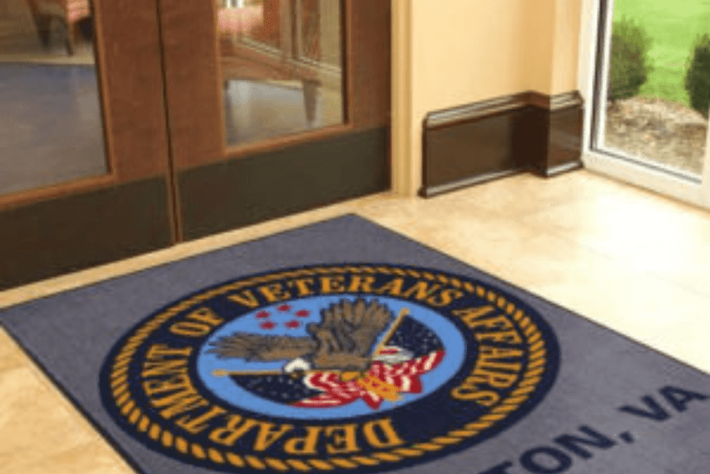 A door mat with the logo of the virginia veteran's administration.