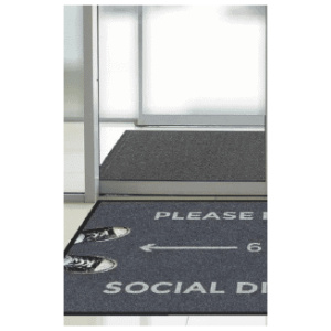A door mat with a sign that says please use social media.