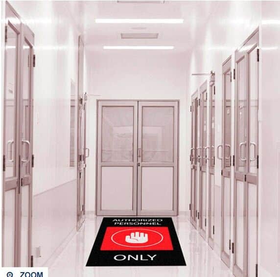 A hallway in a hospital with a sign that says only.