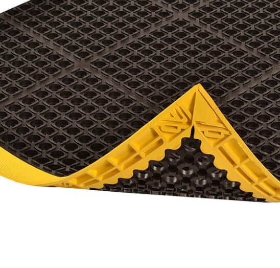 A black and yellow mat on top of a white background.