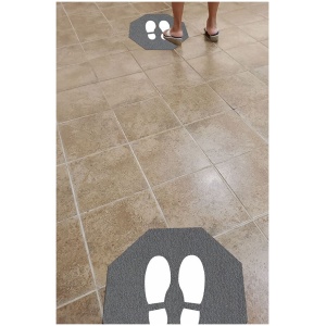 A person standing on a Stick-and-Stand Floor Mat.