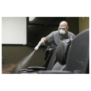 A man sanitizing a chair with System3.