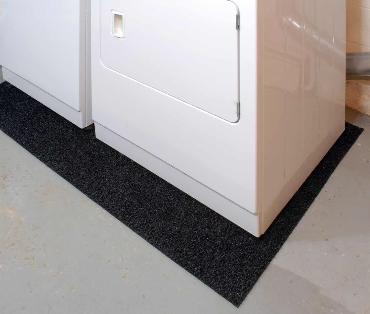 A laundry room with a washer and dryer equipped with noise reduction features.