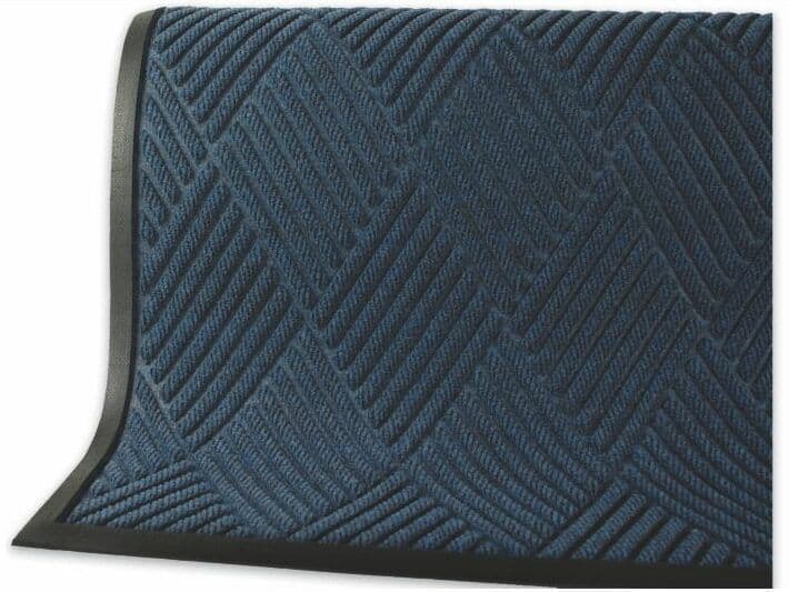 A blue door mat with black trim.
