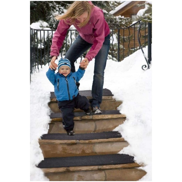 Woman Baby heated steps Floormat.com Outdoor heated mats and heated stair treads melt snow & ice for safe footing without shoveling or chemicals. <b>(GFCI Power Cord not included.)</b> <ul> <li>GFCI Power Unit can connect up to 10 stair tread mats or 5 doormats or 4 walkway mats or any combination thereof, up to 15 amps.</li> <li>GFCI Power Unit Not Included</li> </ul> <h2>Residential Snow Melting Mats and Stair Treads for Safer Homes</h2> <strong>These heated mats prevent snow and ice accumulation on walkways and stairs around your home</strong>. Made of customized thermoplastic materials, the mats are portable and can be left outside for the entire winter season. Our heated mats will generate heat to melt snow at a rate of 2" per hour leaving your pathway to the home clean and clear 24/7. <strong>The Residential Heated Walkway Mat and Heated Stair Mat</strong> can be used independently or interconnected with one another to create a continuous system of snow melting mats. With the mats' built in watertight connector cables, you can Mix and Match walkway and stair mats to create your perfect snow melting solution - all on a single plug! <b>Heated Walkway Mats & Heated Stair Tread Mats</b> Payments are processed on a secure server. <h3>Customer Testimonials</h3> <div> "We love our heated stair mats. They are working great during this cold Michigan winter." - Craig, Lansing, MI "This is the best purchase I have made on a New product in ages! It performs better than I could believe! The safety advantage is outstanding. We get a lot of snow and this product kept up with Mother Nature wonderfully. I would give it 5 stars out of 5!" - Lexy, Alpine, NJ "Purchased two about a month ago for my uncovered porch and deck. First tested by putting on deck with several inches of snow; the area was DRY in the morning! Have kept mat on front porch and it has handled more than the 2 inches of snow per hour stated! And we have had plenty--16 inches in one week!" - Gwen, Batavia, IL "I live in the Central Rockies and we've gotten 2-3' snowfalls at a time and this mat has kept the entryway clear and dry, including some subzero nights. Really worth the price. It has prevented the usual accumulation of ice and snow in this area that can prevent opening the door, and it reduces the amount of snow that gets tracked indoors." - Fred, CO "I should have purchased this heated door mat years ago and saved myself some headaches ... and potential falls. I would recommend the manufacturer use a timer to shut the mat off. Other then that. A great idea." - Scott, Hammond, IN "The stair treads have worked wonderfully for me here in Massachusetts. The construction is solid and sturdy and the snow was never a problem." - Dennis, Brockton, MA "As soon as the heated mat arrived that afternoon I placed it on top of the ice and by the evening it had melted all the ice. We are very pleased with how it keeps all snow and ice away from this area. I'm ordering another set for our front door." - Kris, Greenwood, IN </div>