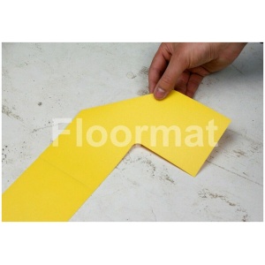 A person cutting a piece of yellow paper on Bridges Pallet Floor Markers.