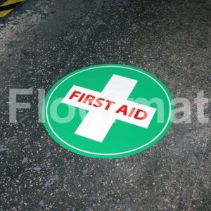 A first aid sign ensuring safety in a factory.