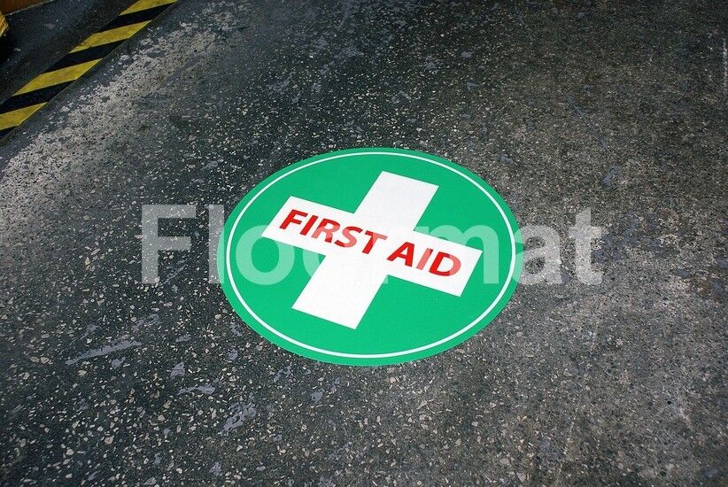 A first aid sign ensuring safety in a factory.