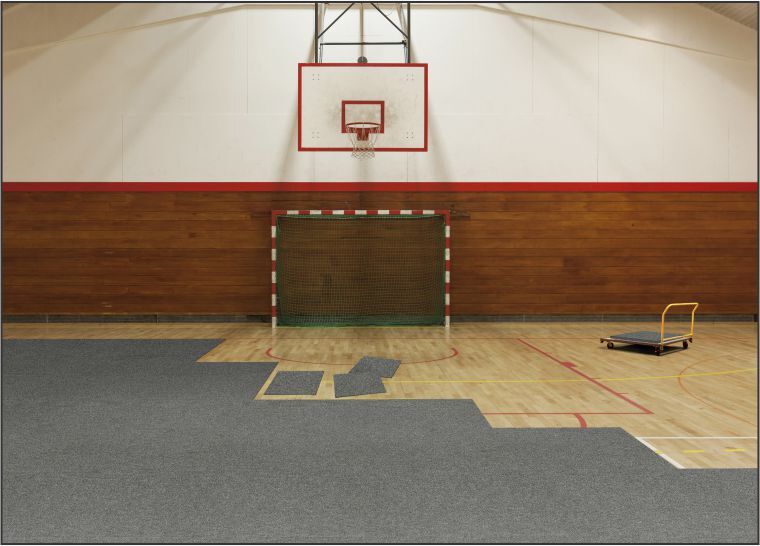 A basketball court with a Floor Safe Tile that provides enhanced safety.