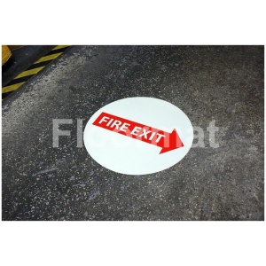 A concrete floor with a Fire Exit Arrow sign.