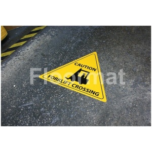 Caution Forklift Crossing sign on factory floor marking forklift crossing.