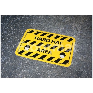 A sign on the ground indicating a Hard Hat Area.