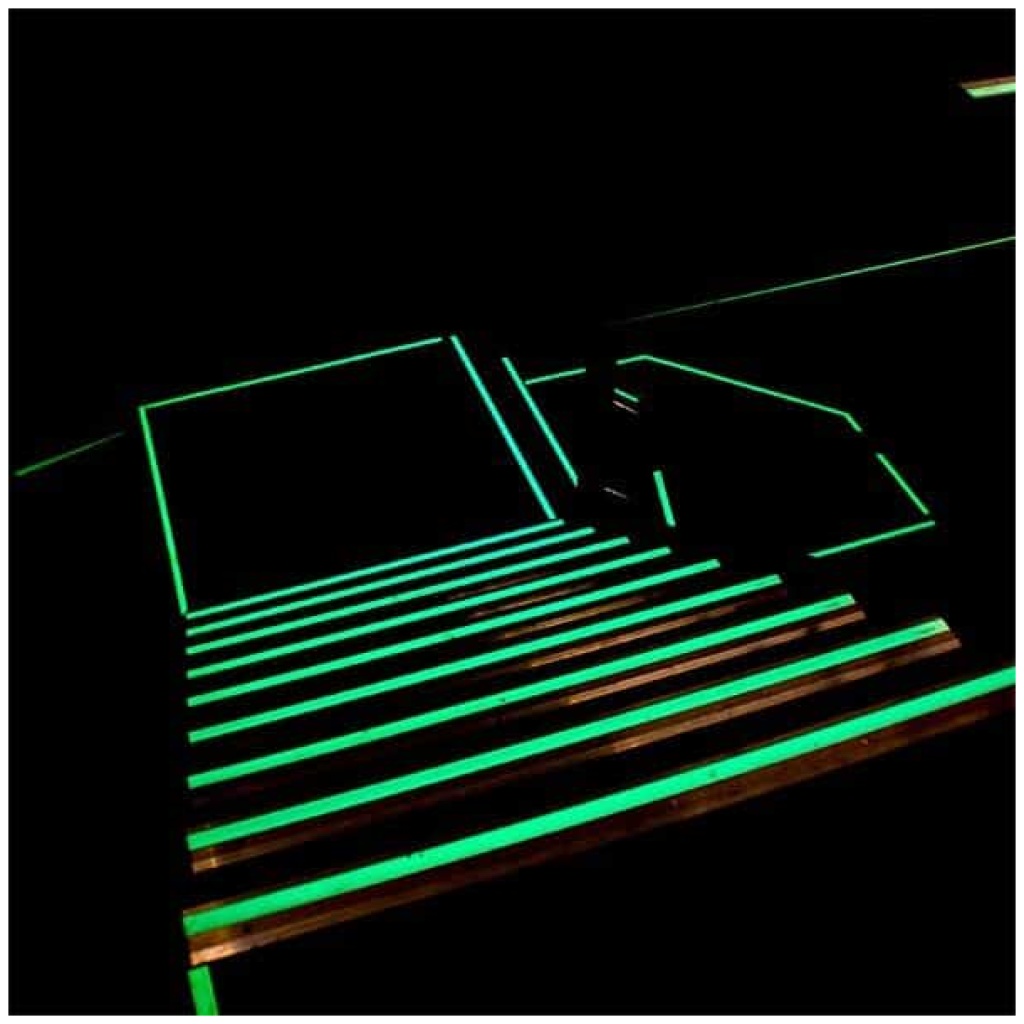 An image of a Glow in the Dark Egress Marking Tape lit staircase.