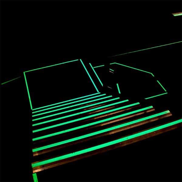 An image of a Glow in the Dark Egress Marking Tape lit staircase.