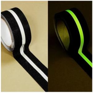 A black and green grip tape with a glow in the dark stripe.