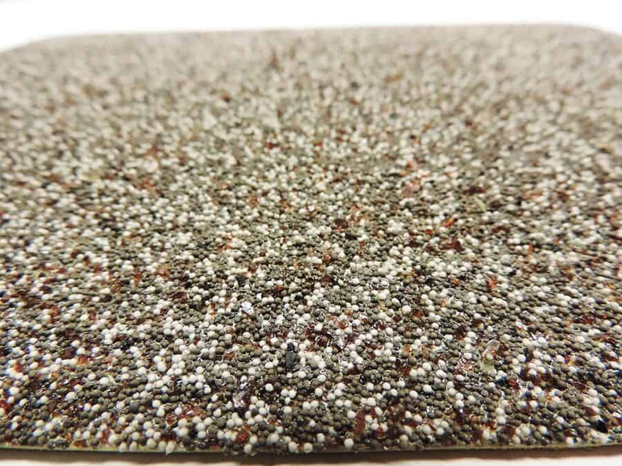 A close up of Grip Rock Freezer Floor Mat on a white surface mat.