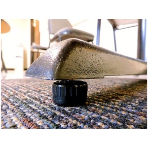 A Glide Table Self Leveling with a black knob on it.