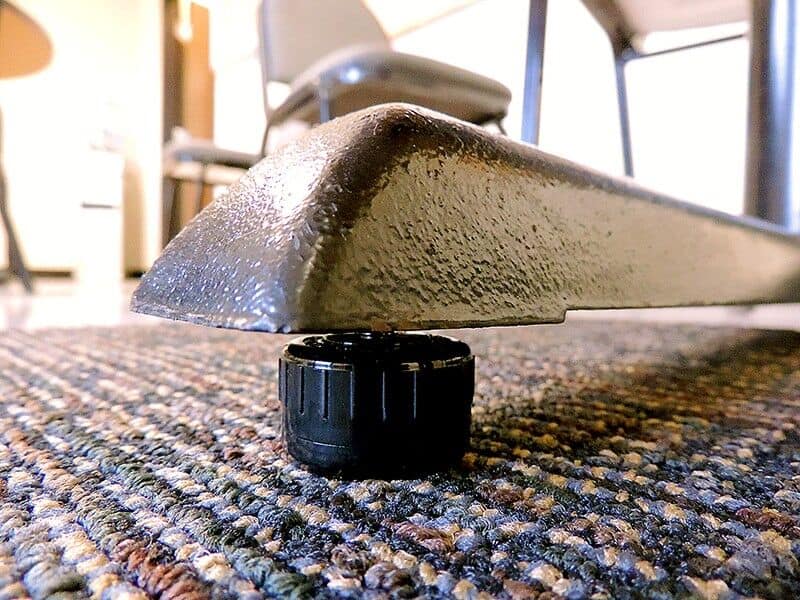 A Glide Table Self Leveling with a black knob on it.