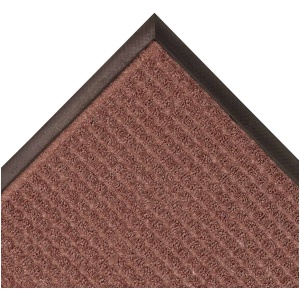 A brown Guzzler floor mat with a black border.
