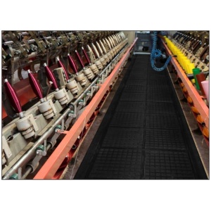 A machine with a lot of threads on its Hog Heaven III Linkable Comfort Floor Mat surface.