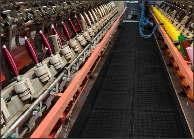 A machine with a lot of threads on its Hog Heaven III Linkable Comfort Floor Mat surface.