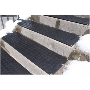 Black rubber steps with snow on them in types of heated floor mats.