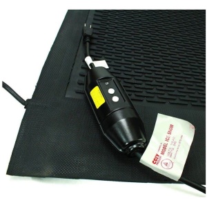 A black mat with a cord attached to it.