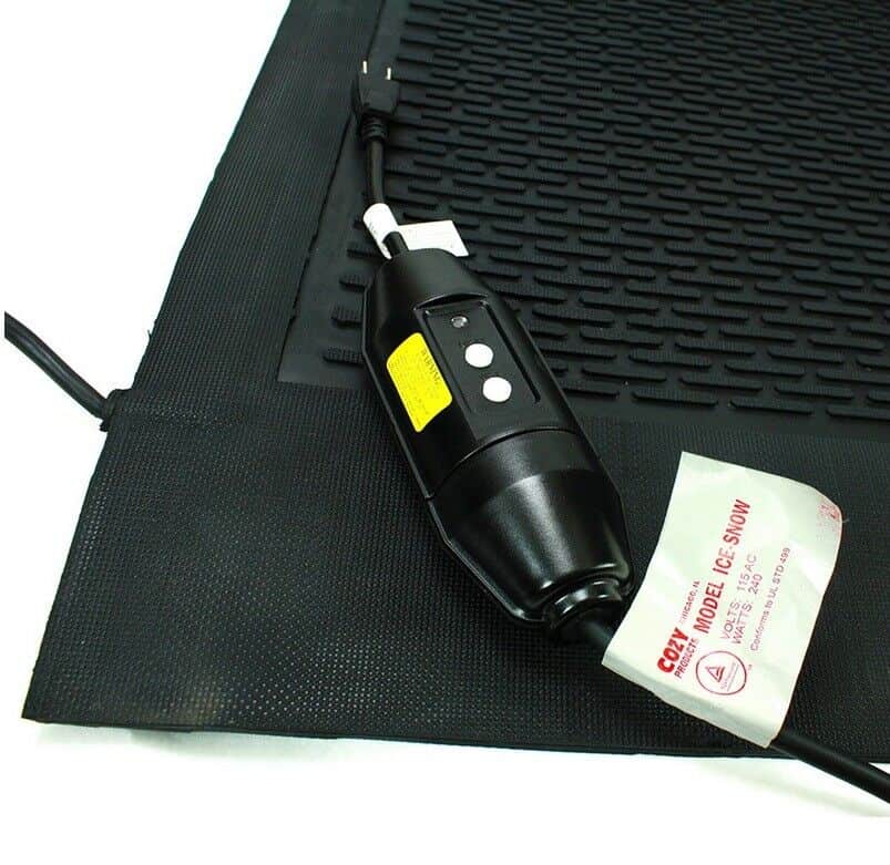 A black mat with a cord attached to it.