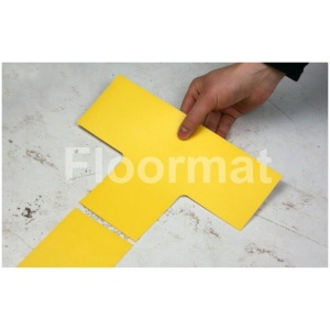 A person cutting a yellow piece of paper on Junctions Pallet Floor Markers.