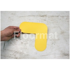 A person holding a yellow piece of paper on an L Pallet Floor Marker palette.