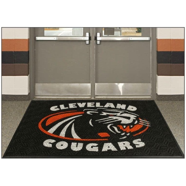 legacy logo Floormat.com The <b>Legacy Inlay Logo Mat </b>offers an alternative to the classic logo mat by using a hexagon patterned material. Logos are cut using up to 19 color options and inlaid into the mat to create a nice, sharp and  crisp image. Due to the UV resistant polypropylene surface material and nitrile rubber backing, this mat will hold up to indoor or outdoor use in medium to heavy traffic applications. Choose from cleated or smooth back and rubber or fabric edges. Custom cuts are also available, give Floormat.com a call for details and pricing! <ul> <li>Thickness: 3/8"</li> <li>Weight: 131 oz. per sq yd.</li> <li>Surface Fiber: Solution Dyed Polypropylene</li> <li>Backing: SBR rubber with 20% post consumer recycled content </li> <li>For use in medium to heavy traffic entryways such as schools, retail outlets, hospitals, airports, grocery stores and other indoor/outdoor entryways </li> </ul>