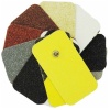 A group of different colored sanding pads on a white background with Johnsonite® OEM Anti-Slip Tread Tape.