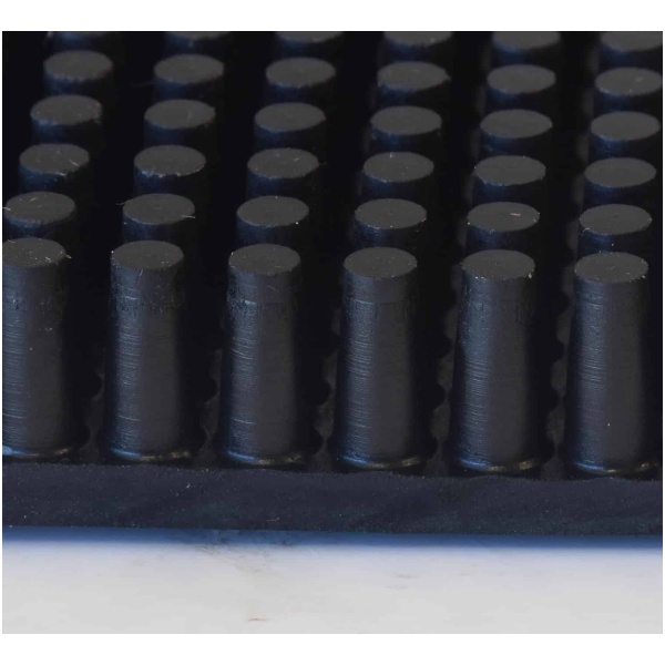 A Rubber Brush with black balls.