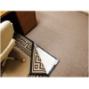A desk with a RugBuddy Under Rug Heating Panel next to it.