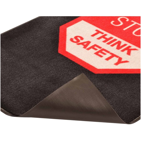 A black Safety Message Floor Mat with a stop think safety sign on it.