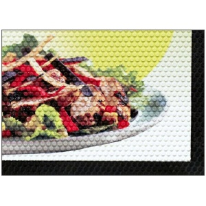 A picture of a salad on a SuperScrape Impressions Logo Floor Mat.