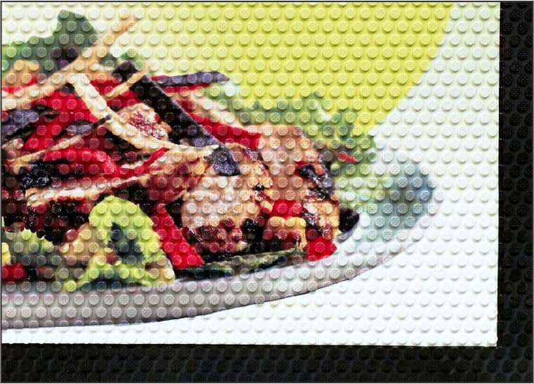 A picture of a salad on a SuperScrape Impressions Logo Floor Mat.