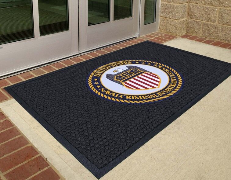 A SuperScrape Impressions logo floor mat with the seal of the United States Navy.
