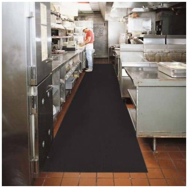 A Sure Tread V-Groove Floor Mat in a commercial kitchen.