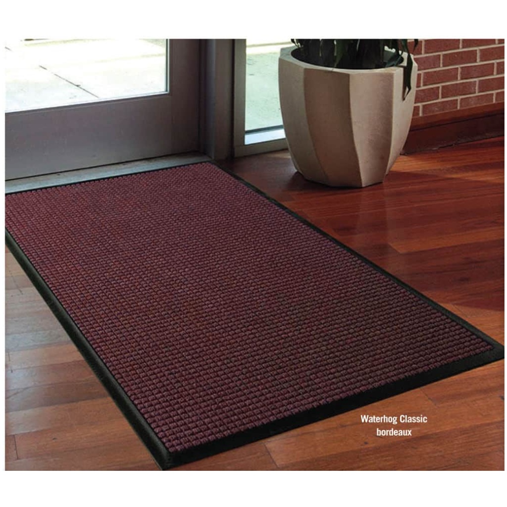 A WaterHog Classic floor mat with a red color on it.
Product Name: WaterHog Classic Floor Mat