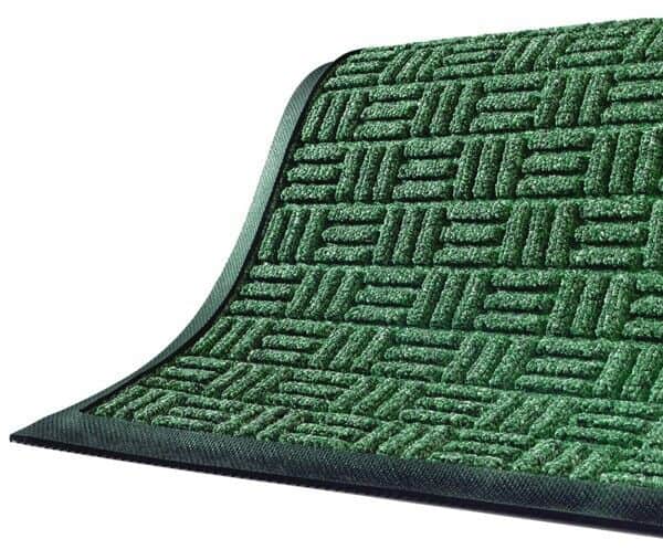A Waterhog Masterpiece Select floor mat showcasing a green door mat on a white background.
