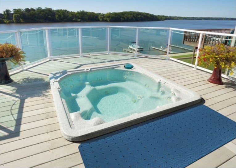 https://www.floormat.com/wp-content/uploads/wet-step-mat-in-front-of-hot-tub.jpg